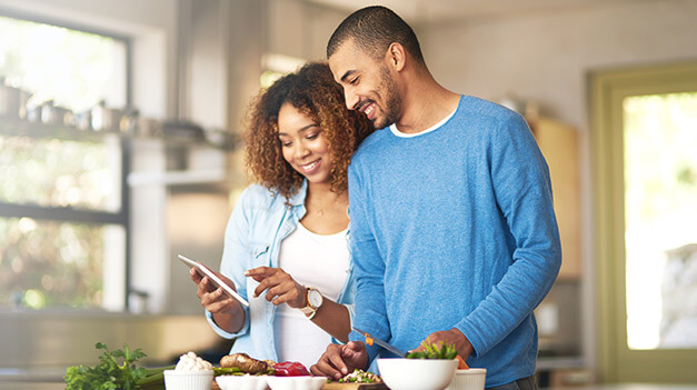 man and woman in kitchen