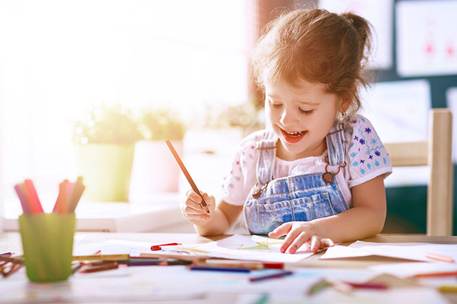 A little girl doing some drawing